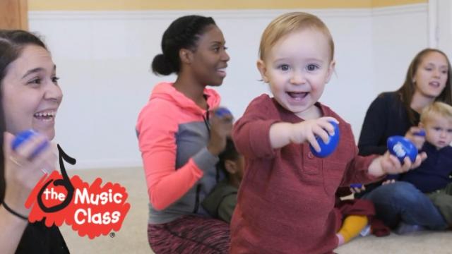smiling child with musical toy